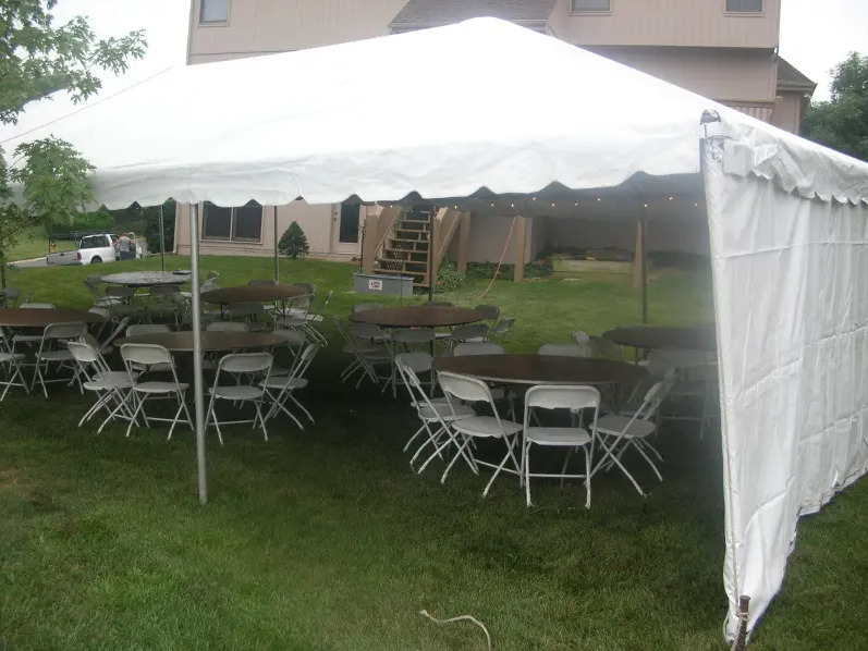 Our Party Tent with Tables Underneath it