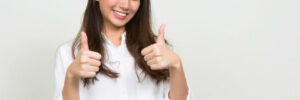 Woman giving thumbs up, signifying she is happy with her choice